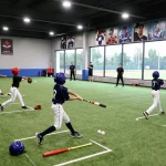 hitclub training session with young athletes focusing on baseball skills in a vibrant indoor facility